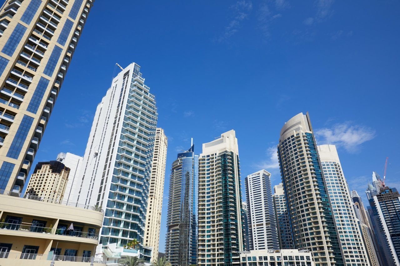 dubai-marina-skyscrapers-low-angle-view-in-a-sunny-day-clear-blue-sky-in-dubai-1.jpg