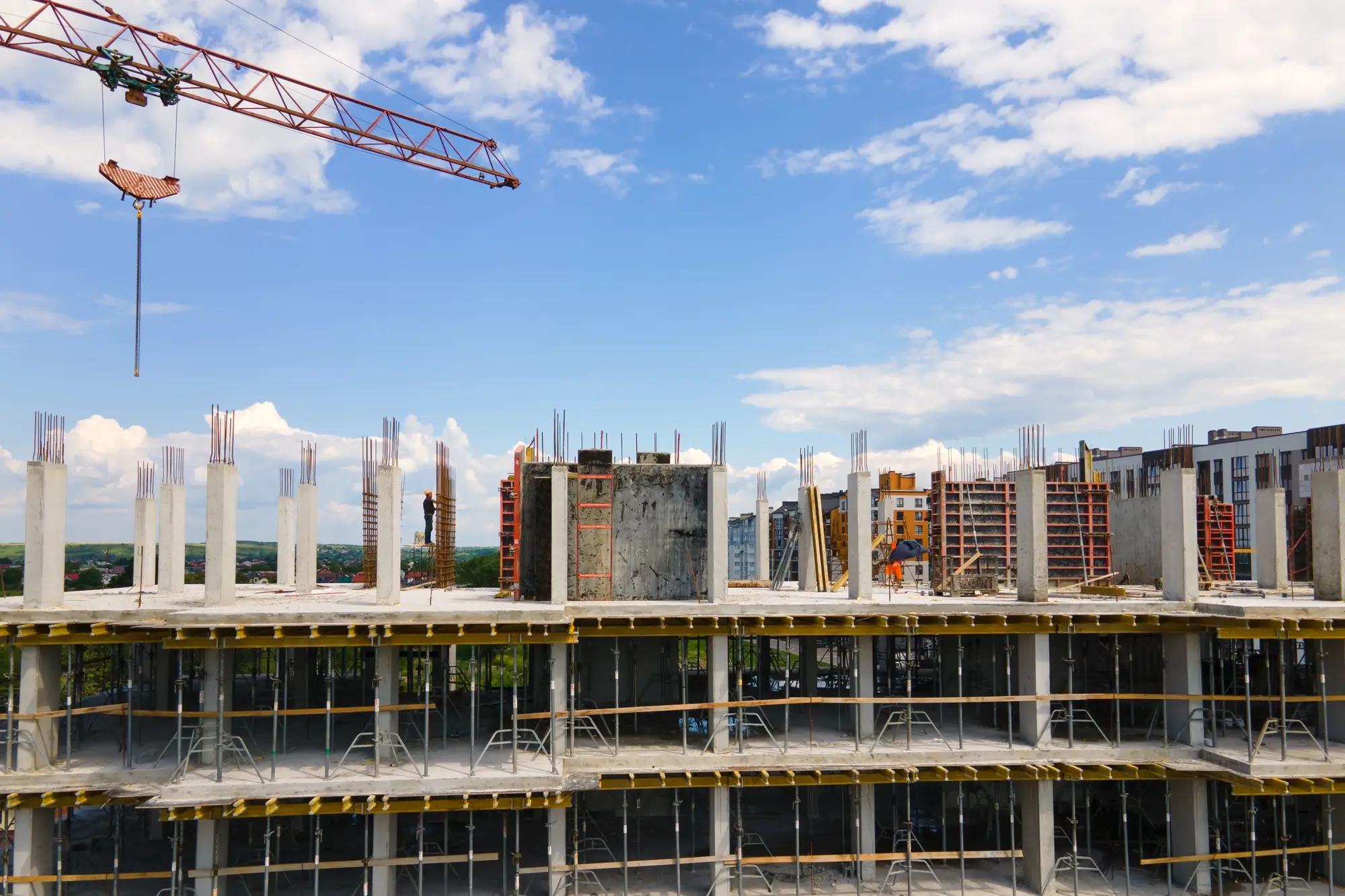 tower-crane-at-high-concrete-residential-building-under-construction-